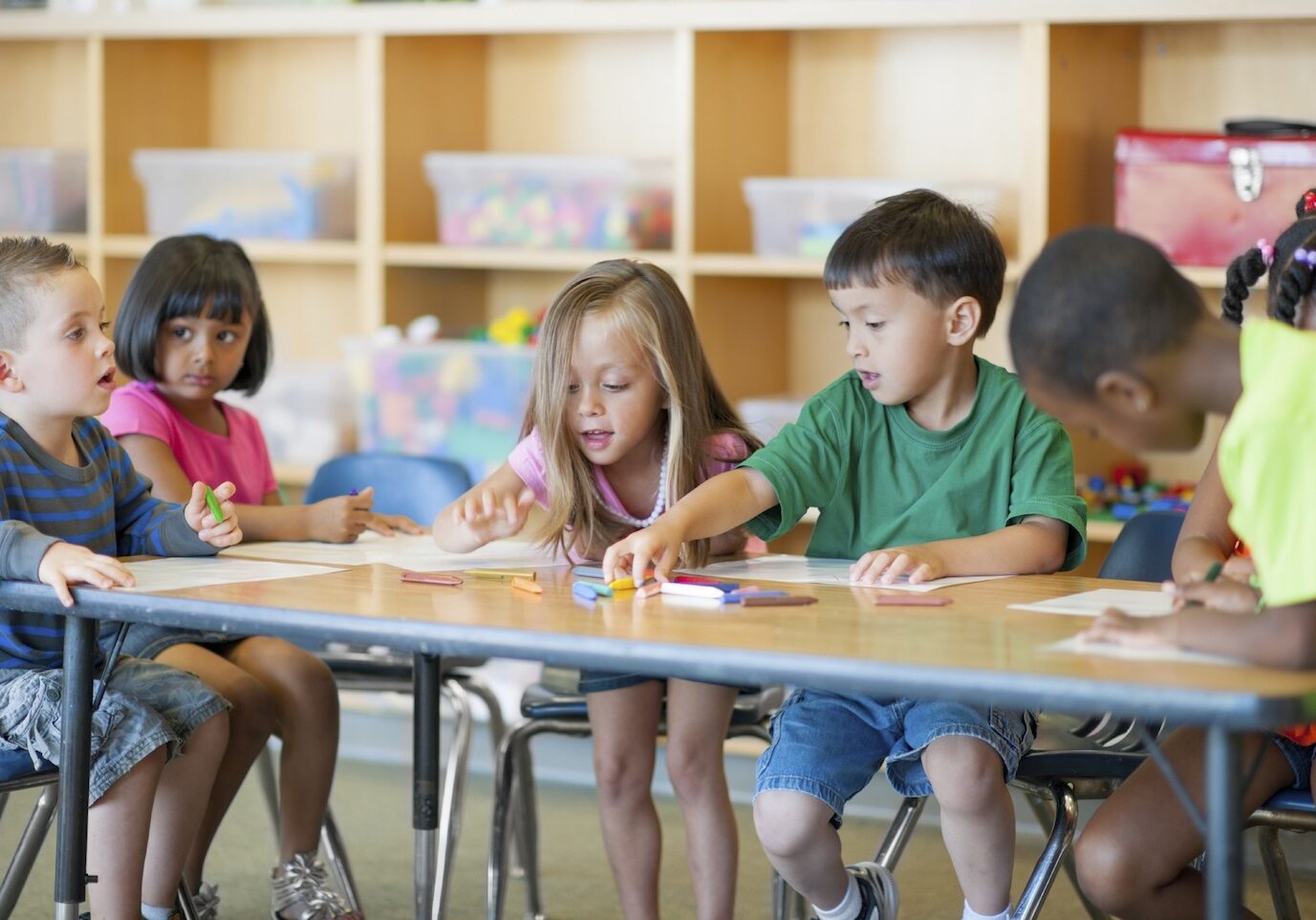 A diverse group of preschoolers in a classroom